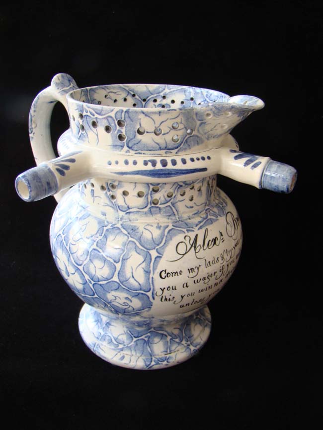 A wonderful 19th century Swansea 'Puzzle Jug' inscribed "Alexander Brown, 1848"